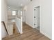 Bright hallway with wood floors, white trim, and natural light from the adjacent living area, creating a welcoming flow at 13175 Telsen St # 40, Winter Garden, FL 34787