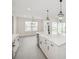 Gourmet kitchen showcasing a large island with breakfast bar, farmhouse sink, and pendant lights at 13175 Telsen St # 40, Winter Garden, FL 34787