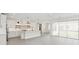 Open-concept kitchen with island, stainless steel appliances, and sliding glass doors at 13175 Telsen St # 40, Winter Garden, FL 34787