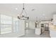 Open concept living room and kitchen with stainless steel appliances and natural light at 13175 Telsen St # 40, Winter Garden, FL 34787