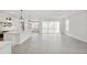 Open floor plan with kitchen and dining area, featuring sliding glass doors to the backyard at 13175 Telsen St # 40, Winter Garden, FL 34787