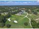 Gorgeous aerial view showcasing the golf course and neighborhood in a lush, green, and serene setting at 1390 Yellow Pine Ct, Winter Springs, FL 32708