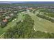 Picturesque aerial view of a beautifully designed golf course nestled amidst green trees and houses at 1390 Yellow Pine Ct, Winter Springs, FL 32708