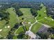 Breathtaking aerial view of a well-manicured golf course, showing a serene and meticulously designed landscape at 1390 Yellow Pine Ct, Winter Springs, FL 32708