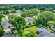 Aerial view highlighting a backyard pool and landscaping, situated on a well-manicured lot at 1390 Yellow Pine Ct, Winter Springs, FL 32708