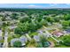 An elevated aerial view of the neighborhood showcasing homes nestled among mature trees and landscaping at 1390 Yellow Pine Ct, Winter Springs, FL 32708