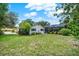 Well-maintained backyard with lush green grass, patio, and screened-in lanai, perfect for outdoor living at 1390 Yellow Pine Ct, Winter Springs, FL 32708