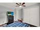 Bedroom with a large closet, neutral paint and trim, television, and ceiling fan at 1390 Yellow Pine Ct, Winter Springs, FL 32708