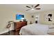 The bedroom features a ceiling fan, dark hardwood floors, and access to a bathroom at 1390 Yellow Pine Ct, Winter Springs, FL 32708
