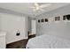 Neutral bedroom featuring a closet, white walls, and wood floors at 1390 Yellow Pine Ct, Winter Springs, FL 32708
