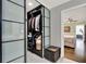 Walk-in closet with glass doors and custom shelving, conveniently situated near the bathroom and bedroom at 1390 Yellow Pine Ct, Winter Springs, FL 32708