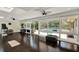 Bright workout area featuring a ceiling fan, access to backyard views and great natural lighting at 1390 Yellow Pine Ct, Winter Springs, FL 32708
