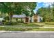 Charming single story home with a manicured lawn, mature trees and inviting curb appeal at 1390 Yellow Pine Ct, Winter Springs, FL 32708