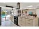 Spacious open-concept kitchen featuring granite countertops, large island, and stainless steel range hood at 1390 Yellow Pine Ct, Winter Springs, FL 32708