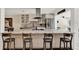 An open kitchen with granite countertops, stainless steel appliances, and breakfast bar seating at 1390 Yellow Pine Ct, Winter Springs, FL 32708