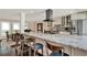 Kitchen with granite countertops, stainless steel appliances, and adjacent dining and living spaces at 1390 Yellow Pine Ct, Winter Springs, FL 32708