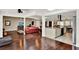 Open floor plan showcases hardwood floors, living room, kitchen island and dining area with great natural light at 1390 Yellow Pine Ct, Winter Springs, FL 32708