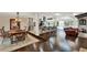 Open concept living space with hardwood floors, a large island and views of the pool at 1390 Yellow Pine Ct, Winter Springs, FL 32708