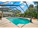 Enjoy the screened pool, outdoor kitchen, patio furniture and landscaped yard at 1390 Yellow Pine Ct, Winter Springs, FL 32708