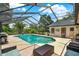 Enjoy the screened pool, outdoor kitchen, patio furniture and landscaped yard at 1390 Yellow Pine Ct, Winter Springs, FL 32708
