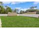 Expansive backyard featuring lush green grass, privacy fence and a handy storage shed at 1395 Deland Ave, Orange City, FL 32763