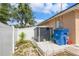 Functional backyard features a shed, providing ample storage alongside a white privacy fence at 1395 Deland Ave, Orange City, FL 32763