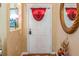 Welcoming front door with a decorative accent and cozy interior at 1395 Deland Ave, Orange City, FL 32763
