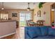 Inviting open-concept living area seamlessly flowing into the dining space with a view of the backyard at 1395 Deland Ave, Orange City, FL 32763
