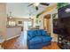 Inviting living area with hardwood floors, archway, and open layout to dining area at 1395 Deland Ave, Orange City, FL 32763