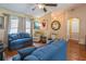 Comfortable living room featuring hardwood floors, stylish furniture, and a cozy ambiance at 1395 Deland Ave, Orange City, FL 32763
