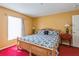 Large primary bedroom featuring bright natural light and neutral color scheme at 1395 Deland Ave, Orange City, FL 32763