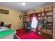 An organized office with red carpet, shelves, desk, and a comfortable black chair at 1395 Deland Ave, Orange City, FL 32763