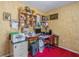 Functional office space with ample storage, desk, computer, and convenient red office chair at 1395 Deland Ave, Orange City, FL 32763