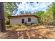 Backyard view of the back of the home, showcasing the home's exterior, siding, and foliage at 149 E Plantation Blvd, Lake Mary, FL 32746