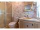 Bathroom featuring a floral wallpaper, mirror, and a shower with sliding glass doors at 149 E Plantation Blvd, Lake Mary, FL 32746