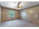 Bedroom with textured walls, carpet flooring, ceiling fan and window with backyard view at 149 E Plantation Blvd, Lake Mary, FL 32746