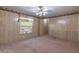 Bedroom with carpet flooring, a window, textured walls and access to a closet at 149 E Plantation Blvd, Lake Mary, FL 32746