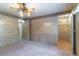 Bedroom featuring carpet flooring, ceiling fan, and access to a walk-in closet and other rooms at 149 E Plantation Blvd, Lake Mary, FL 32746