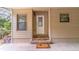 Spacious carport featuring a covered entryway, concrete flooring, and access to both the house and screened in porch at 149 E Plantation Blvd, Lake Mary, FL 32746