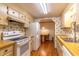 Traditional kitchen features wooden cabinets, modern appliances and a connected dining area at 149 E Plantation Blvd, Lake Mary, FL 32746