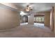 Large living room with carpeted floor and a view into the breakfast nook at 149 E Plantation Blvd, Lake Mary, FL 32746