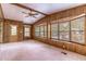 View of living room offering carpeted floors, wood paneling, and natural light at 149 E Plantation Blvd, Lake Mary, FL 32746
