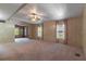 Spacious living room features carpeted floors, a ceiling fan and plenty of natural light at 149 E Plantation Blvd, Lake Mary, FL 32746