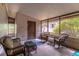 Cozy screened porch with comfortable seating, offering a relaxing outdoor living space at 149 E Plantation Blvd, Lake Mary, FL 32746
