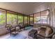 Cozy screened porch with comfortable seating, offering a relaxing outdoor living space at 149 E Plantation Blvd, Lake Mary, FL 32746