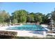 Inviting community swimming pool surrounded by lounge chairs and greenery in a serene and refreshing setting at 149 E Plantation Blvd, Lake Mary, FL 32746