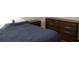 Cozy bedroom with a comfortable bed, dresser, and nightstand at 149 Southampton Dr, Kissimmee, FL 34744