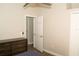 Bedroom featuring a dresser and an open doorway at 149 Southampton Dr, Kissimmee, FL 34744