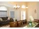 Inviting dining area filled with natural light, adjacent to a comfortable living space at 149 Southampton Dr, Kissimmee, FL 34744