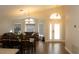 Open-concept living and dining area with hardwood floors and abundant natural light at 149 Southampton Dr, Kissimmee, FL 34744